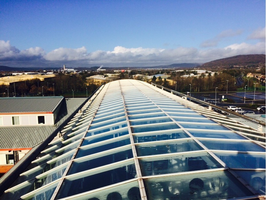 Aerial perspective of a curved commercial glass roof under installation in Nottingham